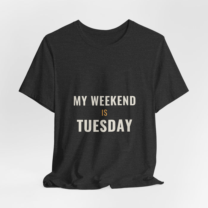 Dark grey heather My Weekend Is Tuesday t-shirt shown draped, front print visible.