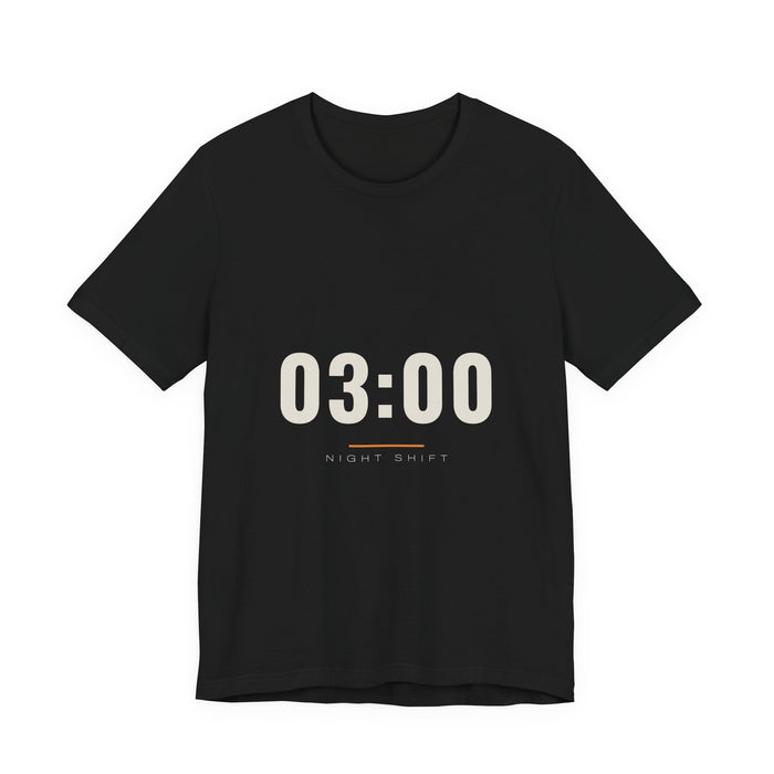 The time 03:00 in tall cream numerals above a thin rule and the words Night Shift, printed on a black unisex t-shirt.