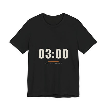 The time 03:00 in tall cream numerals above a thin rule and the words Night Shift, printed on a black unisex t-shirt.