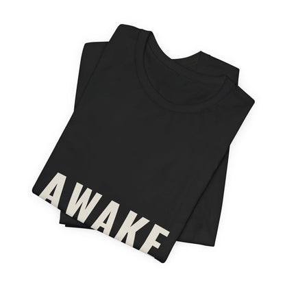 Black Awake t-shirt folded to show the front print at an angle.