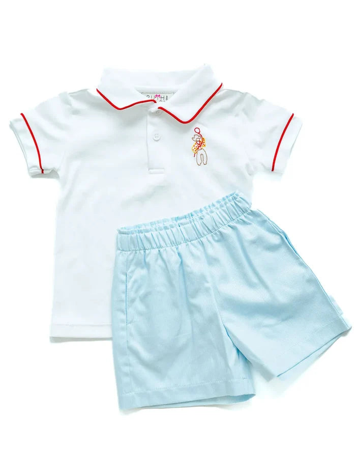 Flat lay of embroidered cowboy polo and shorts set.