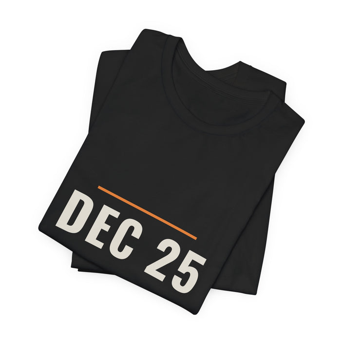 Black Dec 25 t-shirt folded to show the front print at an angle.