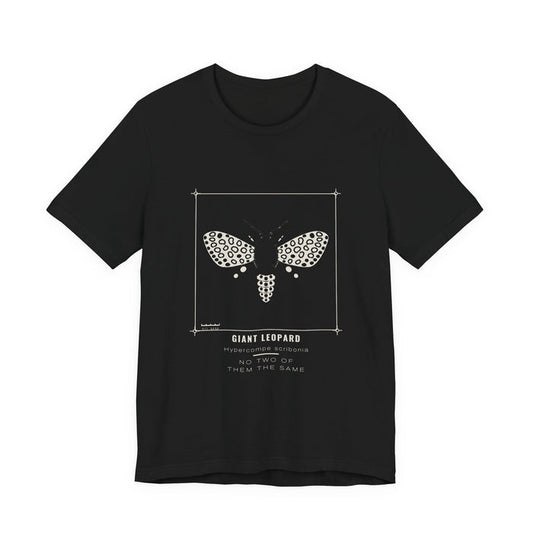 A cream giant leopard moth covered in open black rings and a spotted abdomen, drawn as a specimen plate inside a thin bracket frame with a 50 mm scale bar, labelled GIANT LEOPARD / Hypercompe scribonia, printed on a black unisex t-shirt.