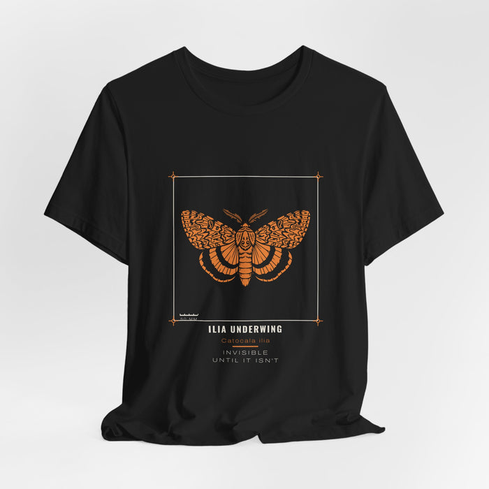 Black Ilia Underwing t-shirt shown draped, front print visible.