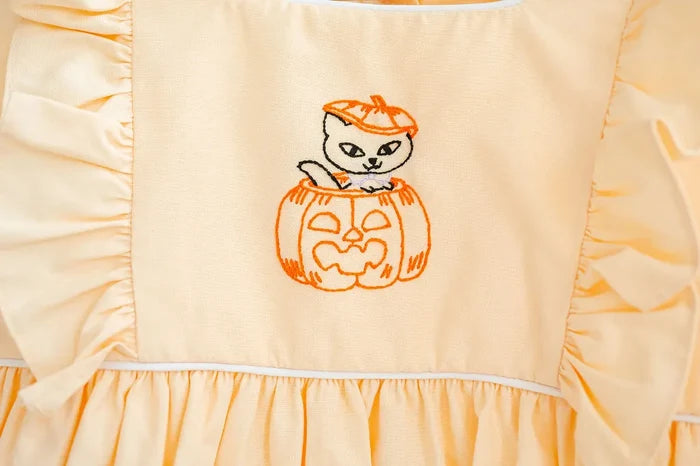 CLOSE UP OF HAND embroidered KITTY IN JACK O'LANTERN BUBBLE