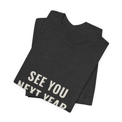 Dark grey heather See You Next Year t-shirt folded to show the front print at an angle.