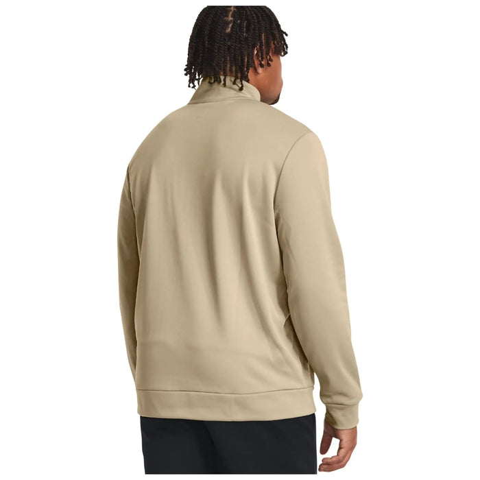 A person wearing a light beige jacket faces away with their hands resting at their sides against a plain white background. The jacket has a high collar and a relaxed fit.