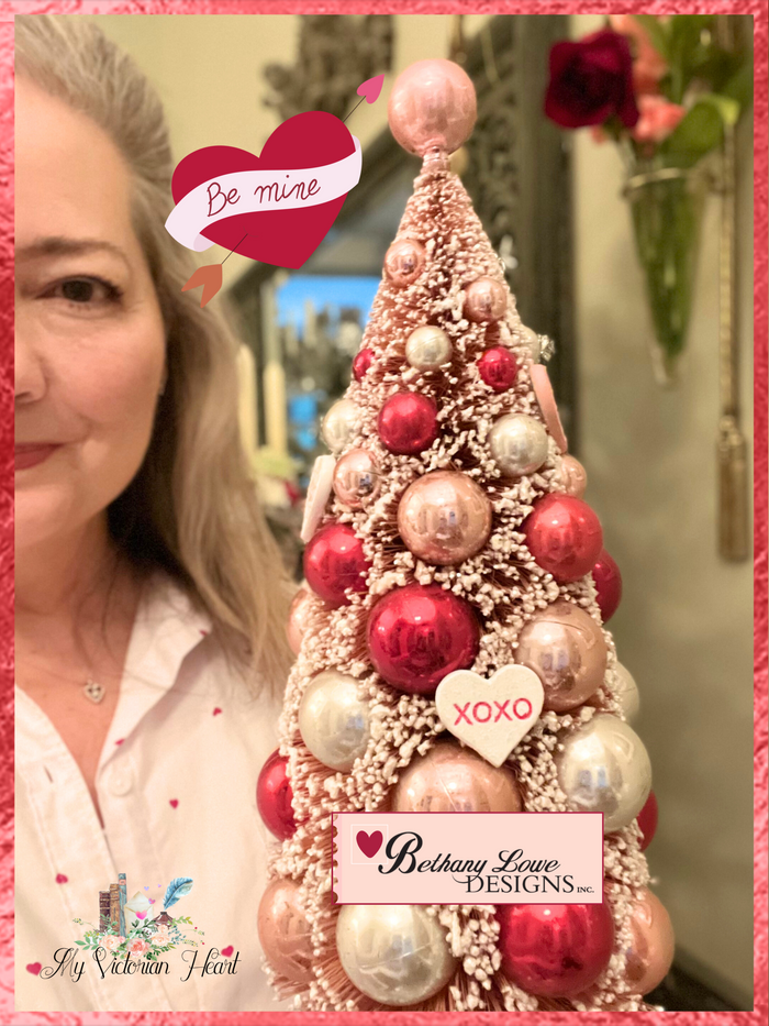 XOXO Valentine's Day Bottle Brush Tree decorated with hearts and pink, white and silver ornaments by Bethany Lowe Designs brand.